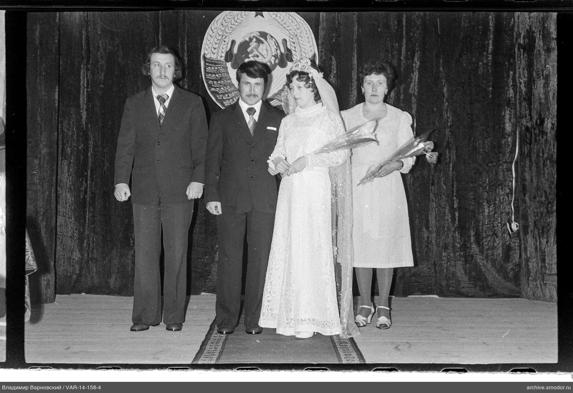 Group portrait on stage with USSR emblem