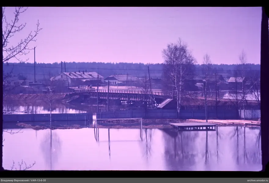Water body with pier and bridge over river