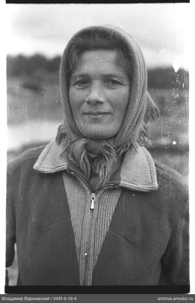 Portrait of a woman in headscarf and coat