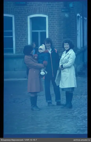 Group portrait by brick building