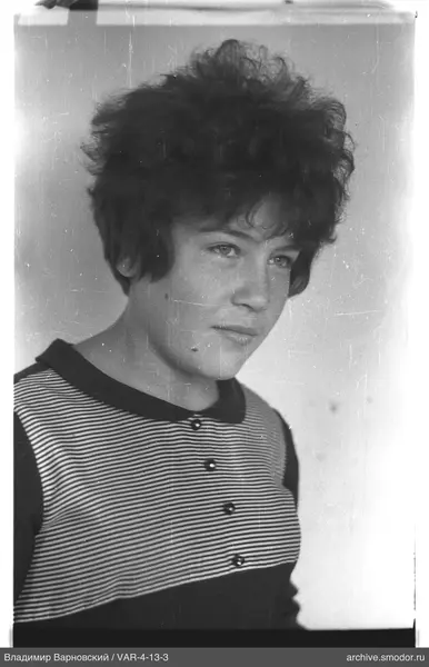 Portrait of a woman with short curly hair