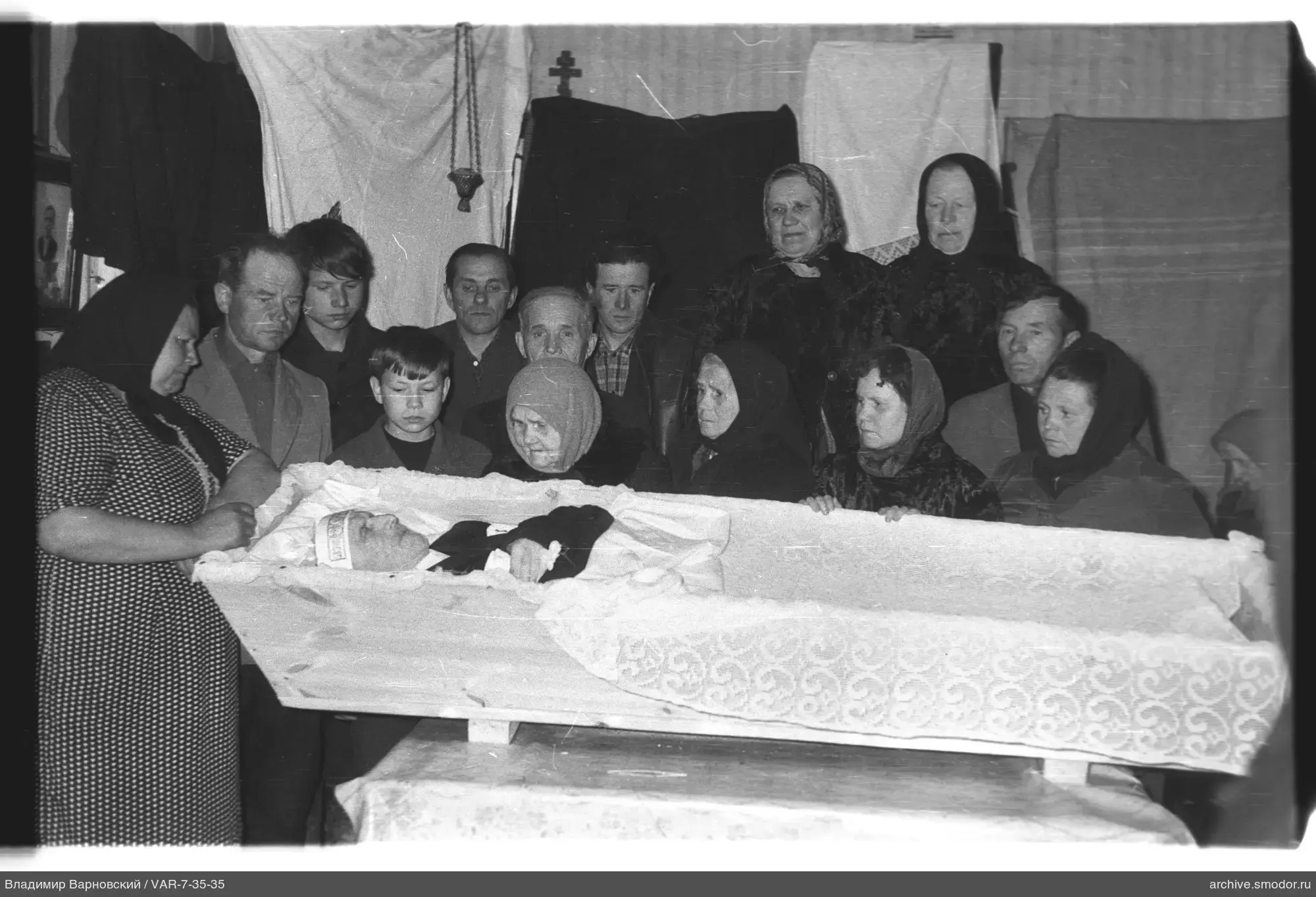 Group portrait around a coffin