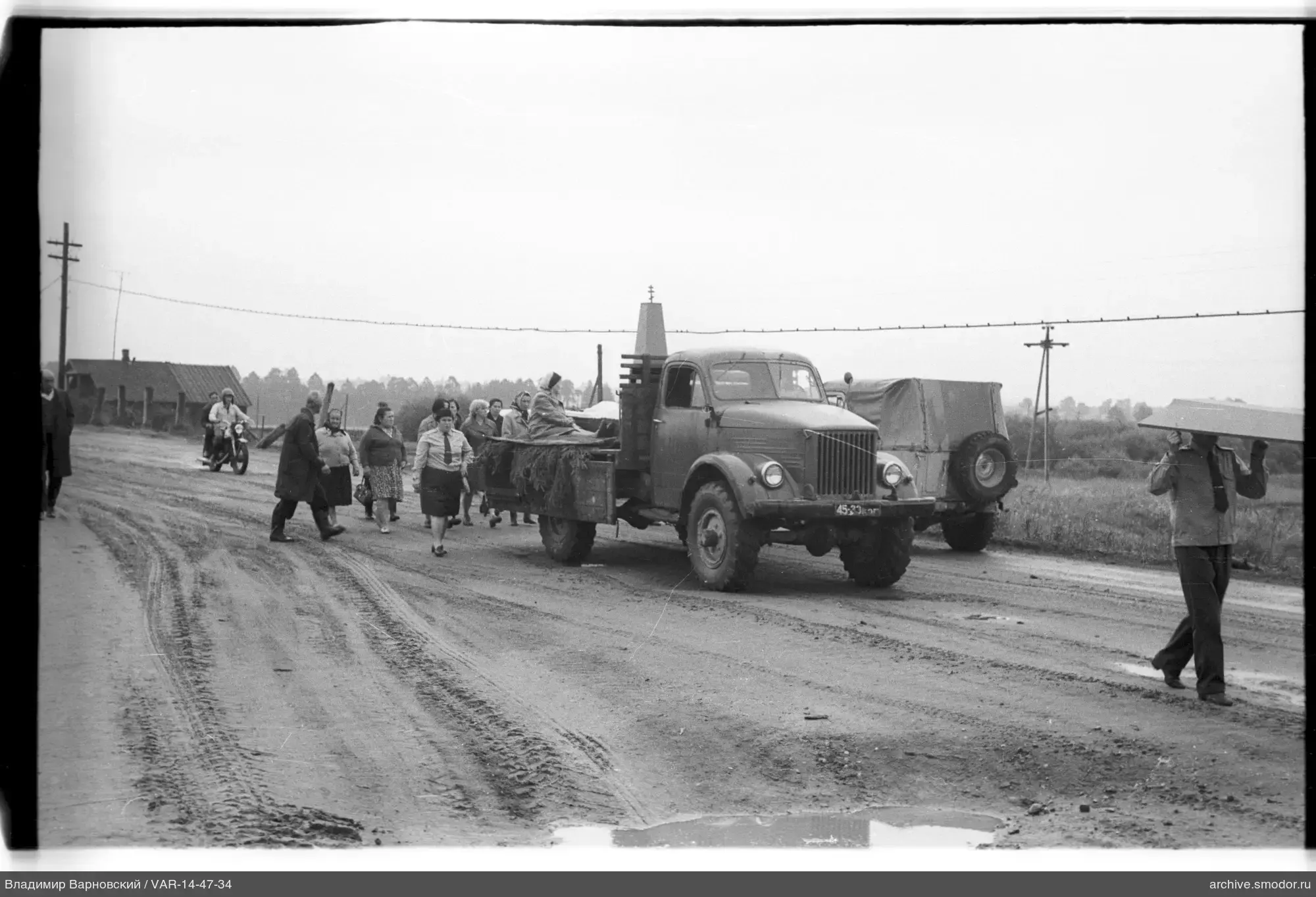Group of people with truck and cart