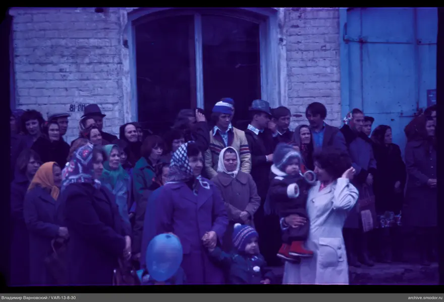 Group of people by brick building