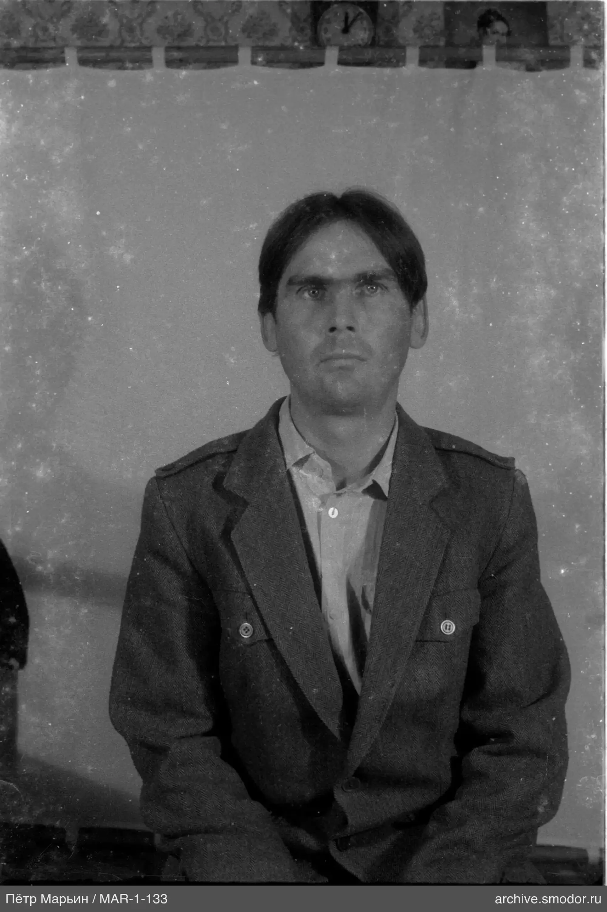 Portrait of a man in a jacket and shirt
