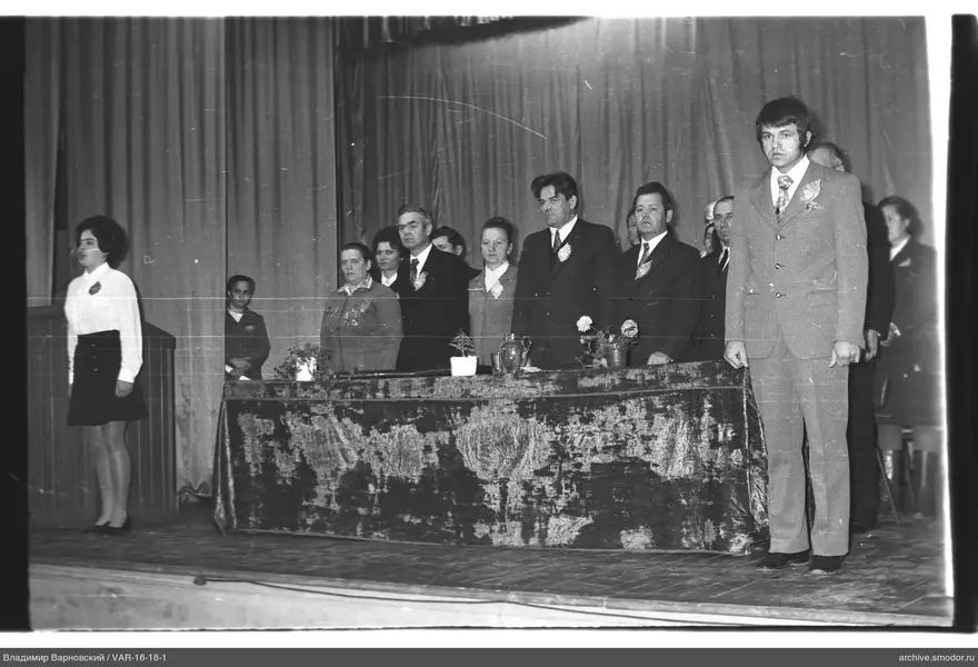Men and women at a table during an event