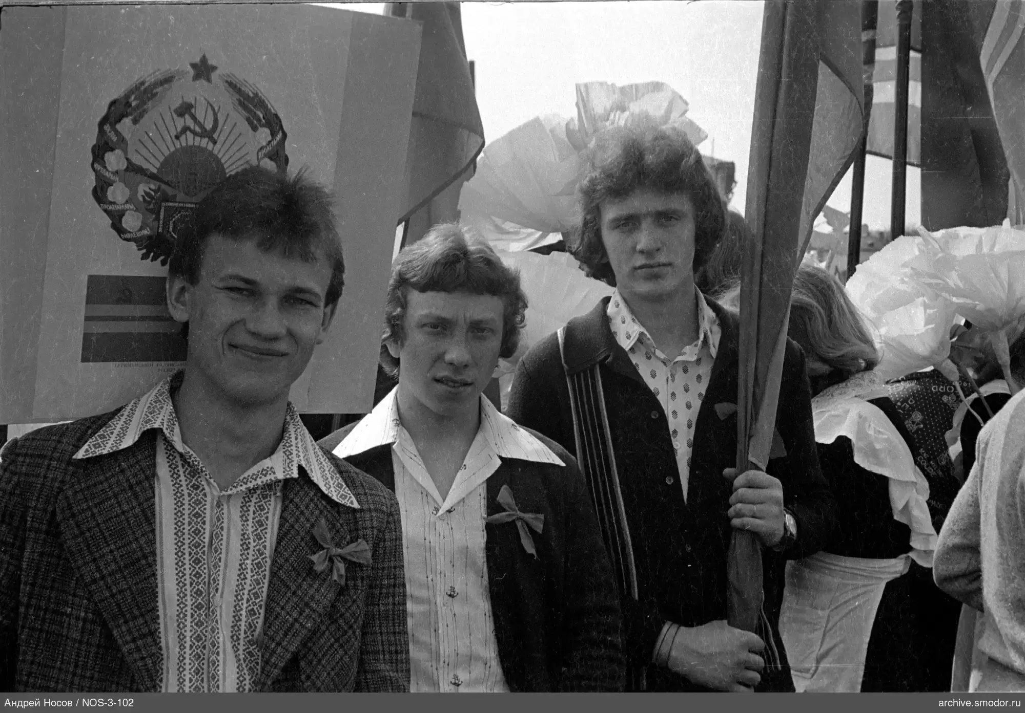 Group of young men with flags and ribbons