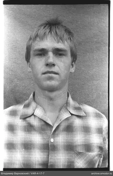 Portrait of a man in a checkered shirt
