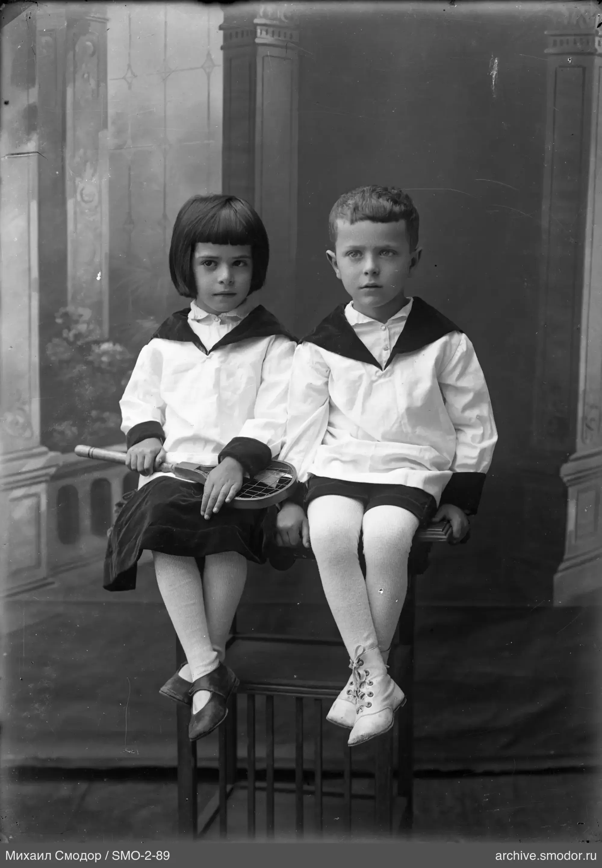 Group portrait of children on a bench