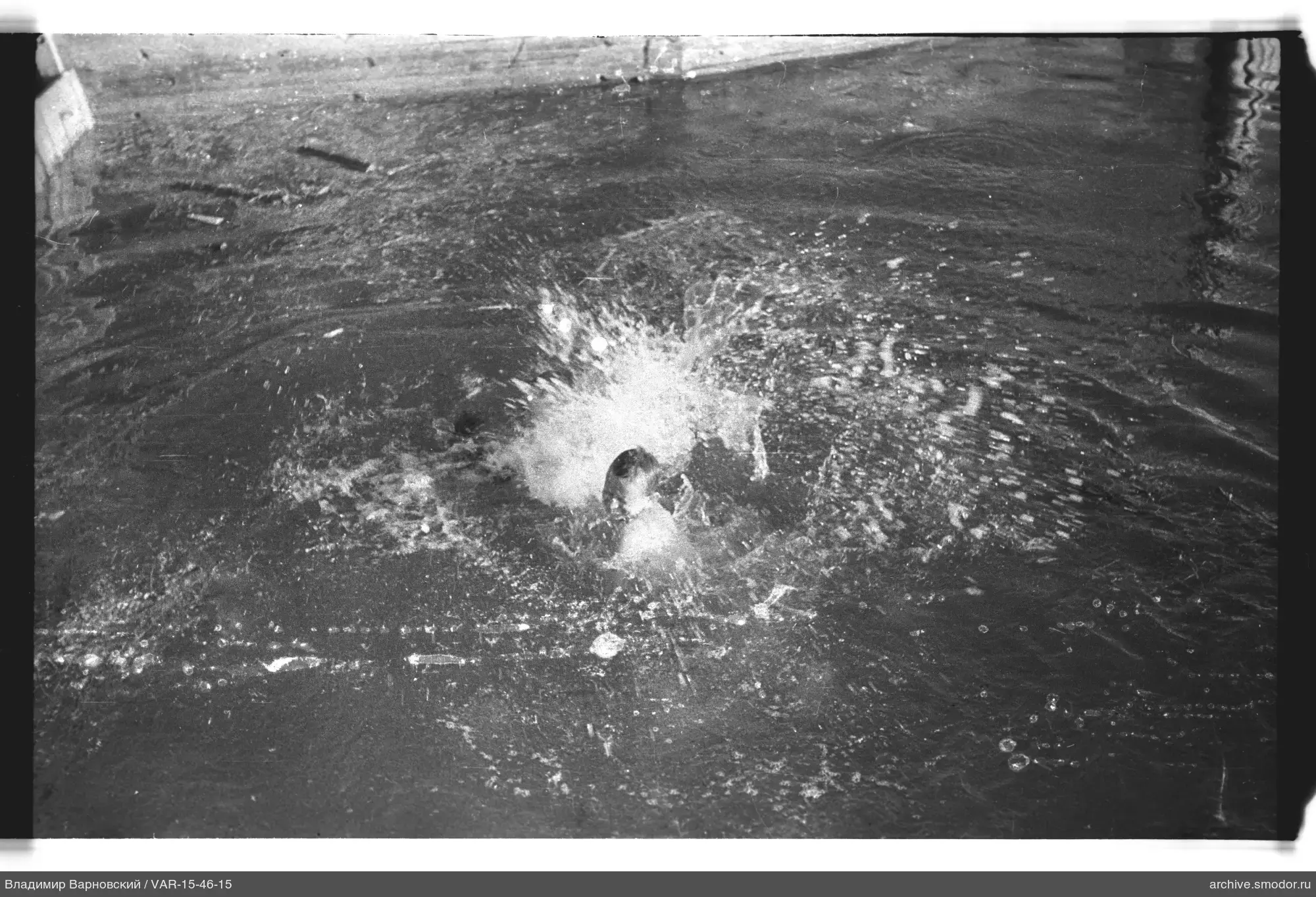 Person's head in water with splashes