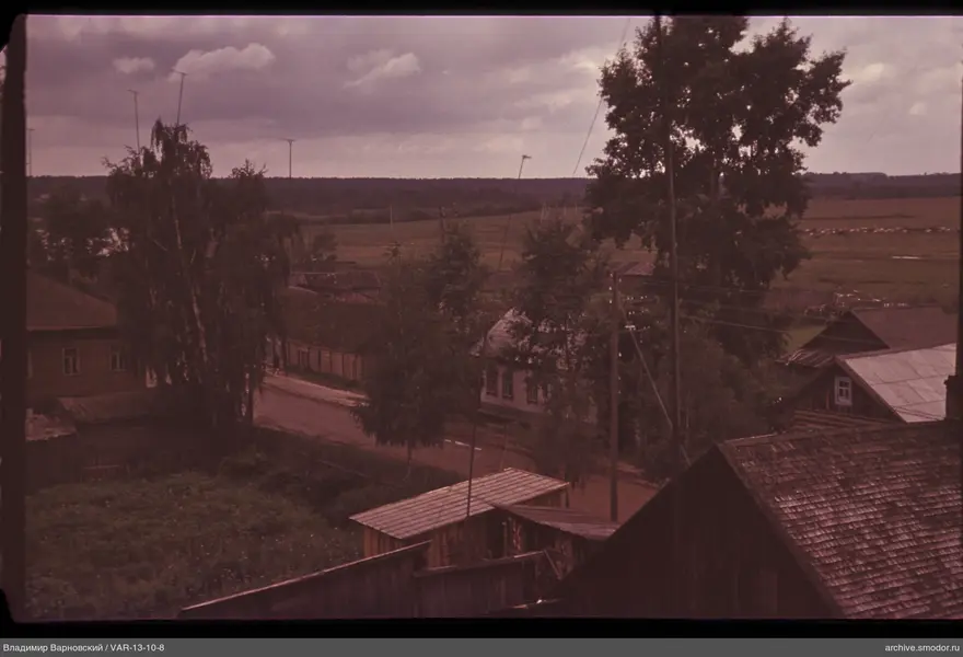 Wooden houses with antennas and dirt road