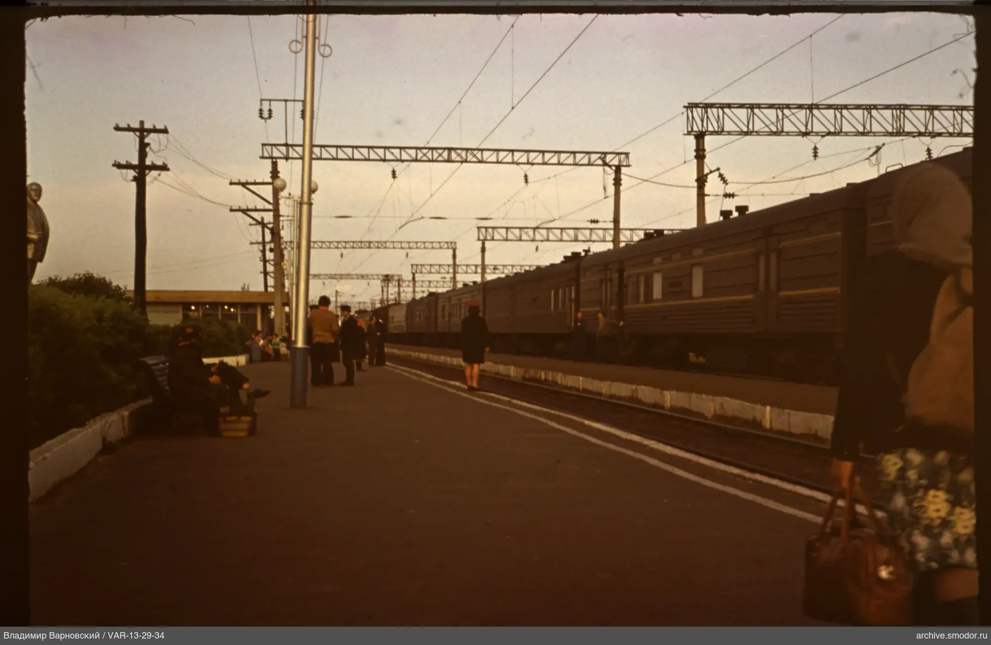 Railway platform with passengers and train