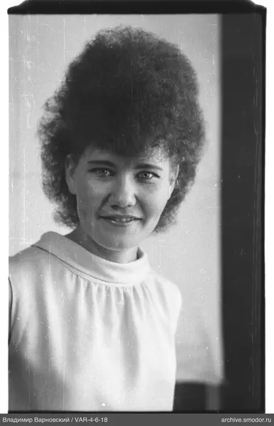Portrait of a woman with curly hair