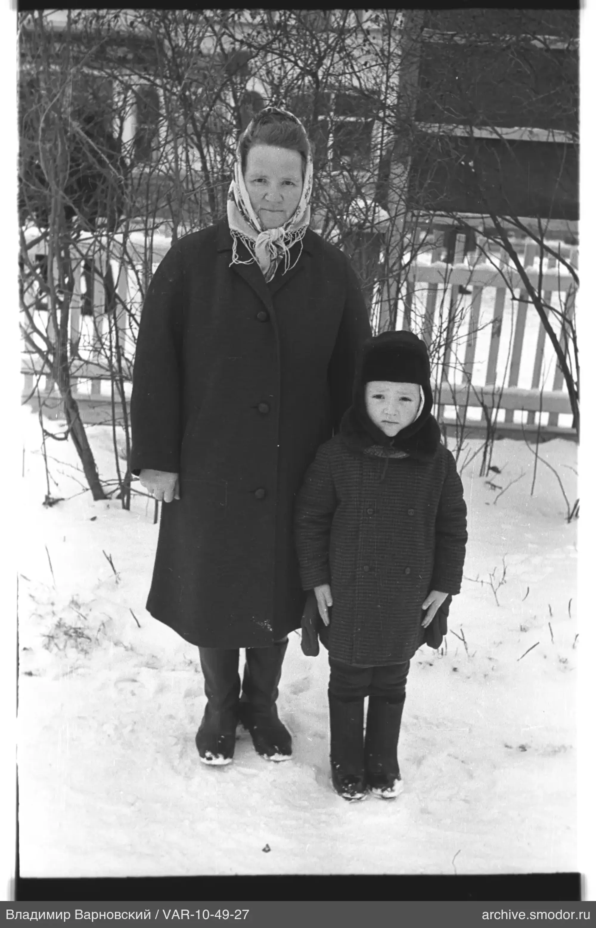 Portrait of a woman and a child in snow