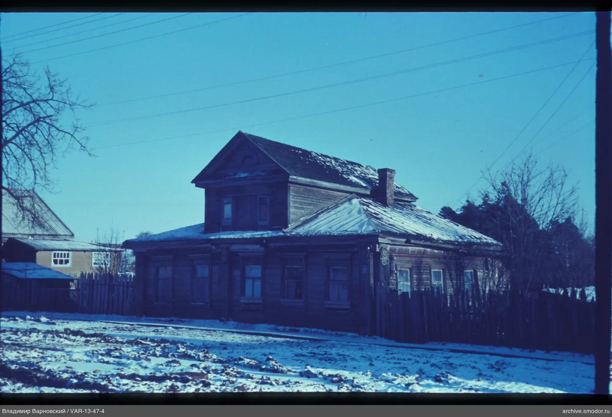Wooden house with snow cover