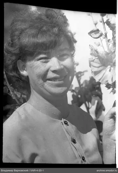 Portrait of a woman with a flower