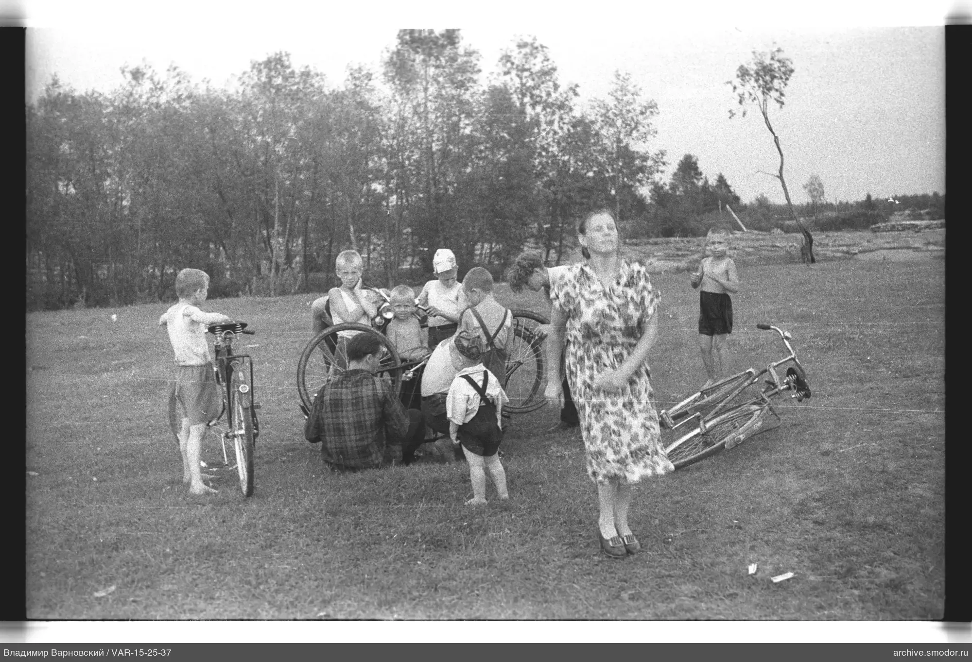 Group of children and woman on grass
