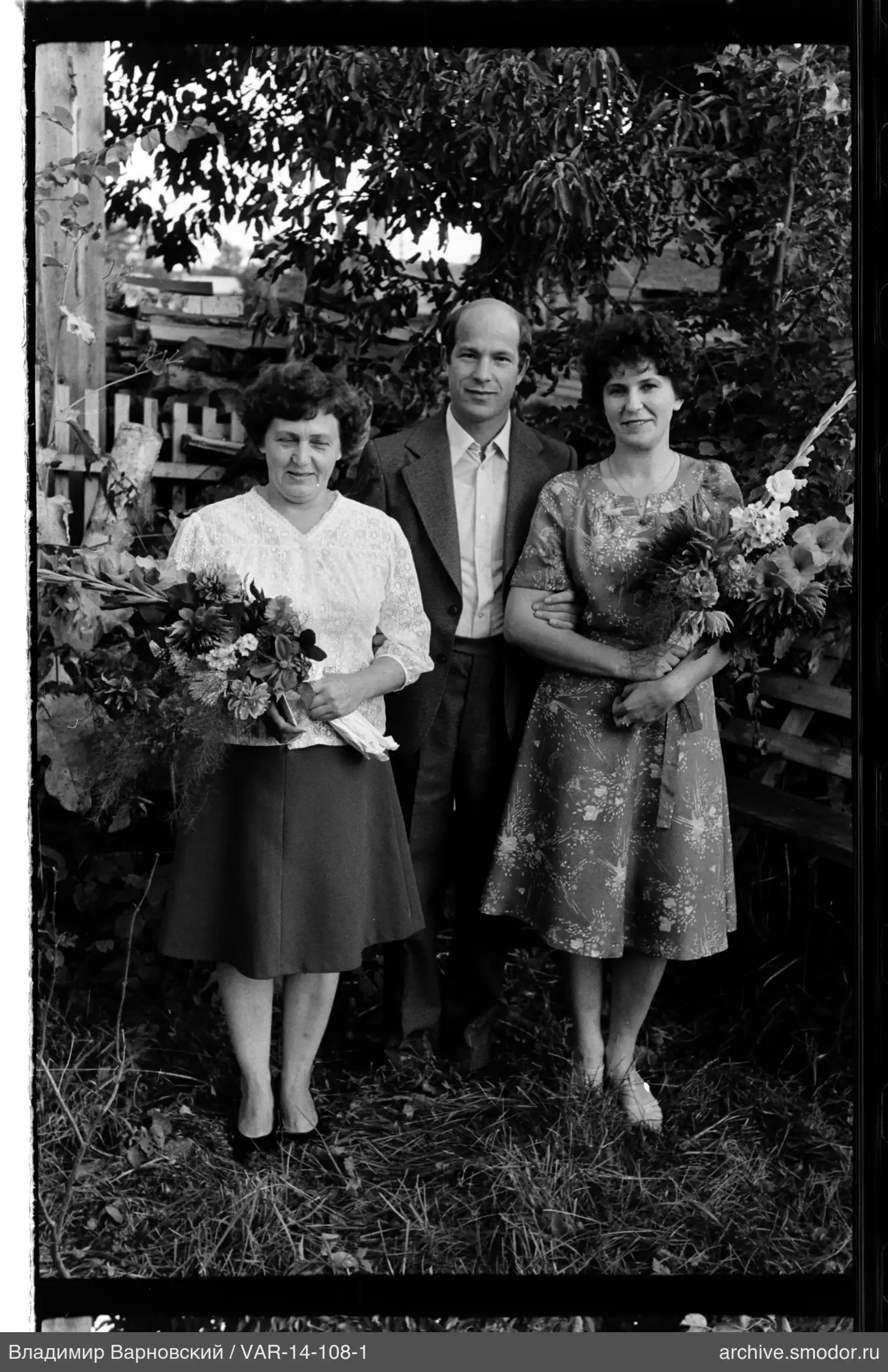 Group portrait of three adults