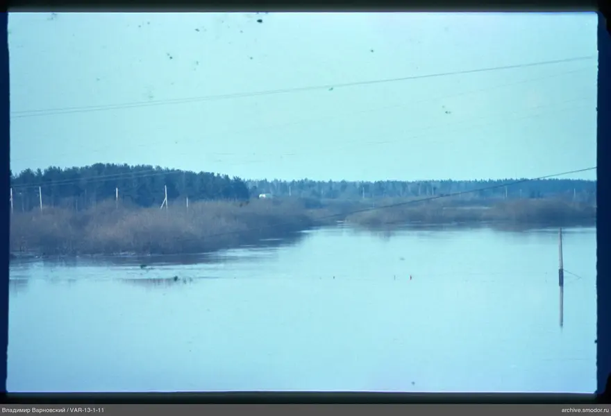 Wide river with reflections of sky and banks
