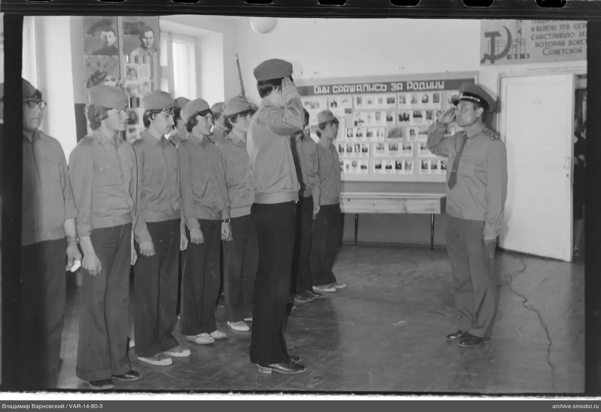 Young men in uniform and officer