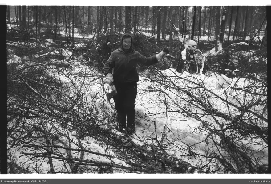 Woman with an axe in a snowy forest