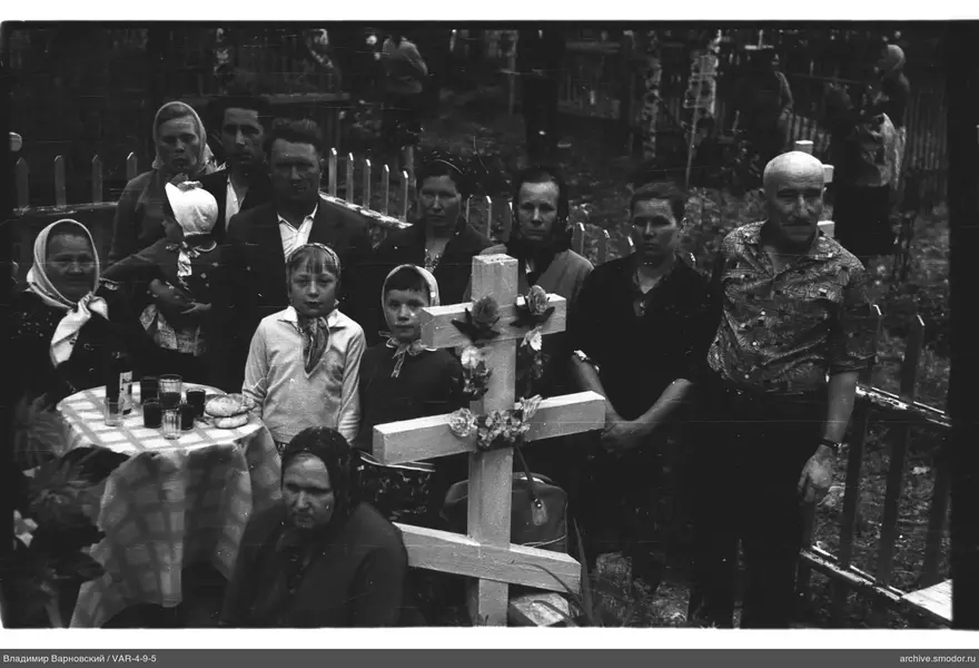 Group around a wooden cross