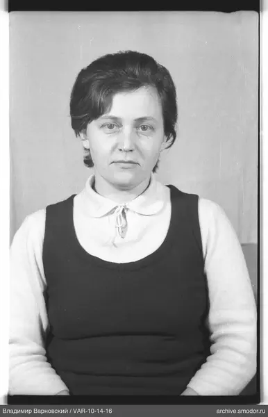 Portrait of a woman in a sweater and vest