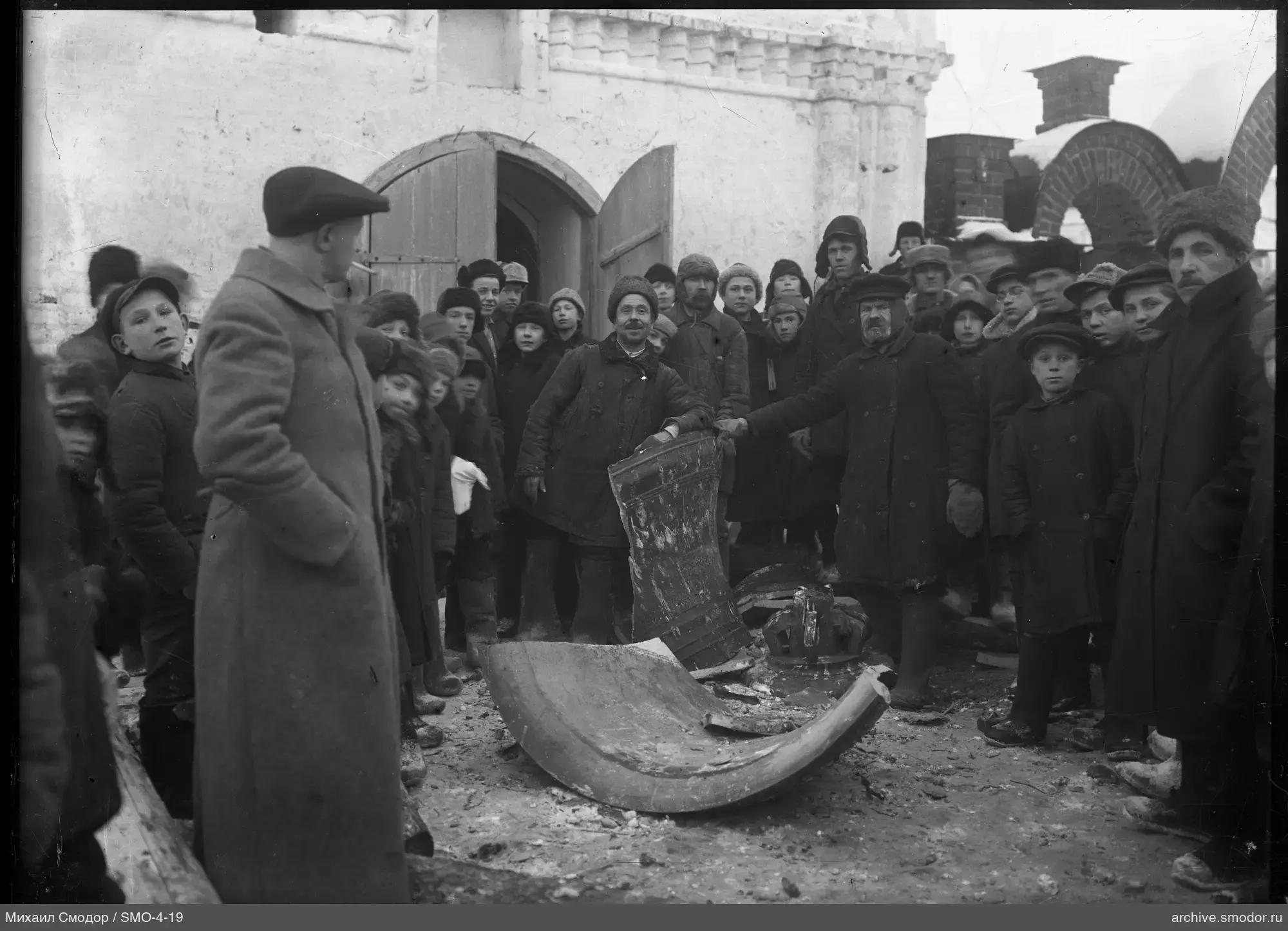 Group of men and boys outside a building