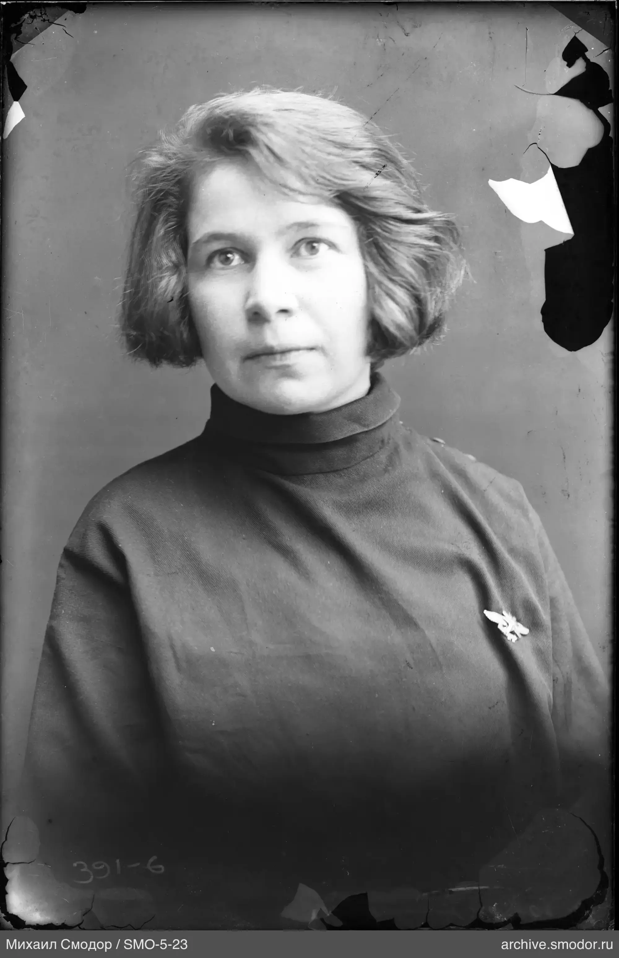 Portrait of a woman with a bird-shaped brooch