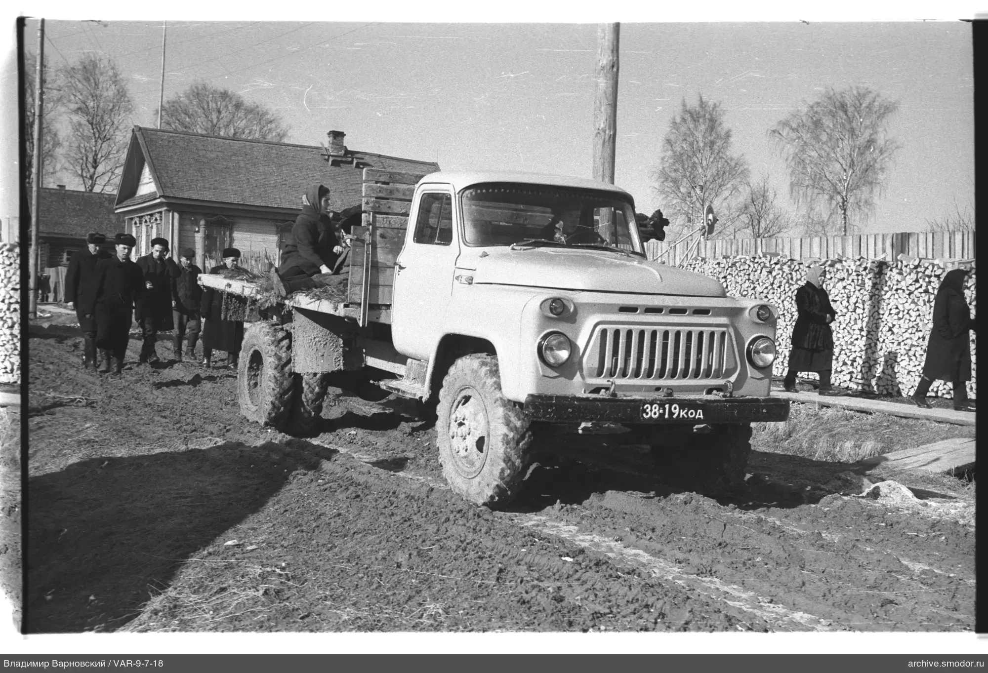Cargo truck with woman in bed