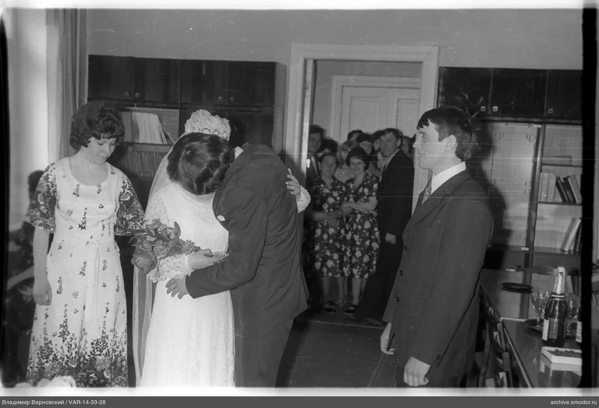 Bride and groom embracing at the wedding