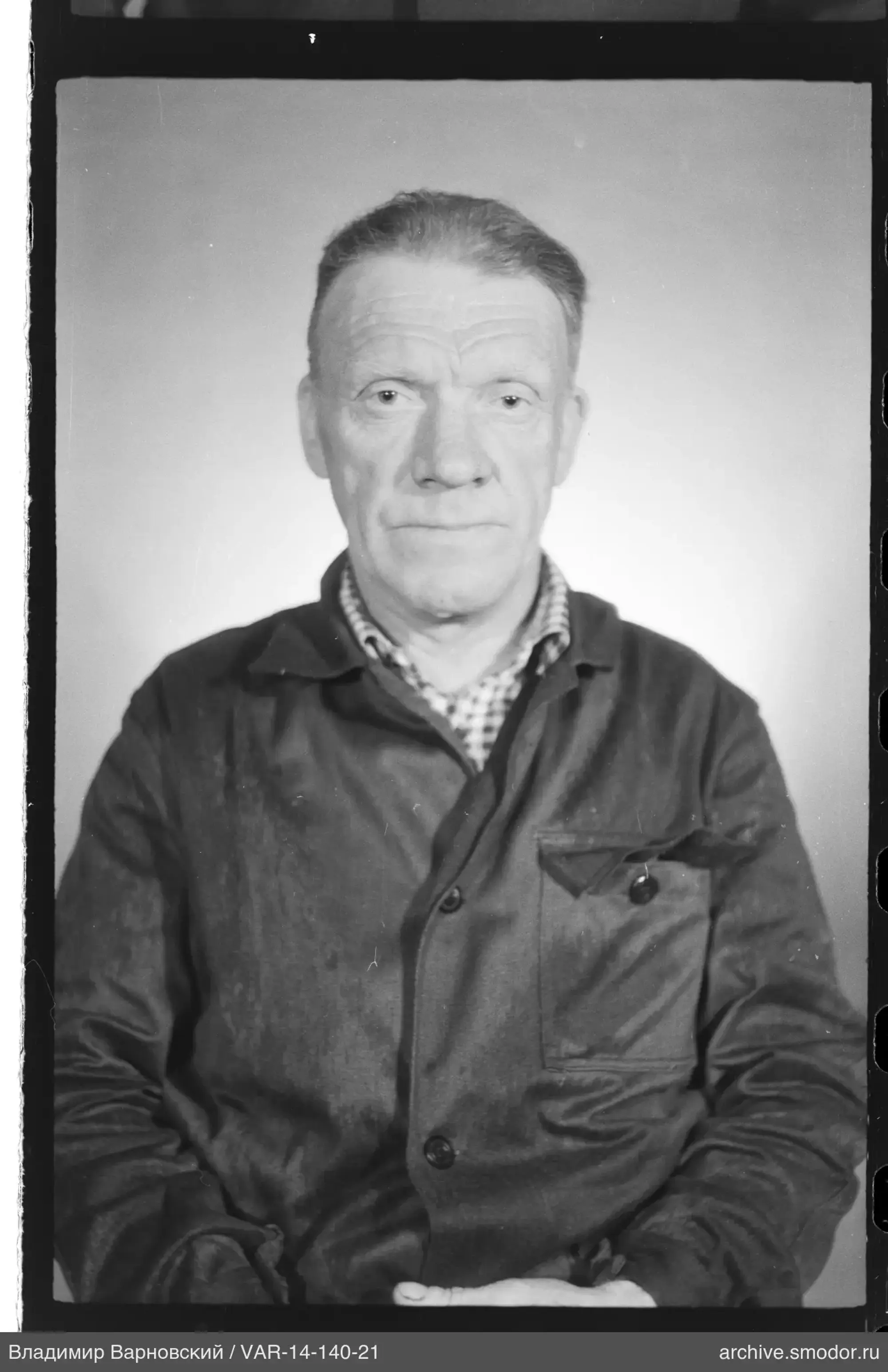 Portrait of a man with hands on knees