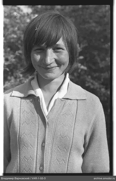Portrait of a woman in a light cardigan