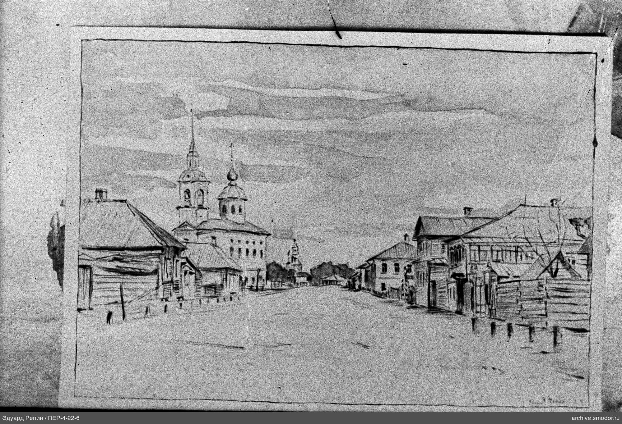 Улица с деревянными домами и церковными башнями