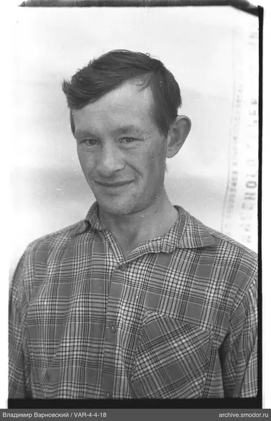Portrait of a man in a checkered shirt
